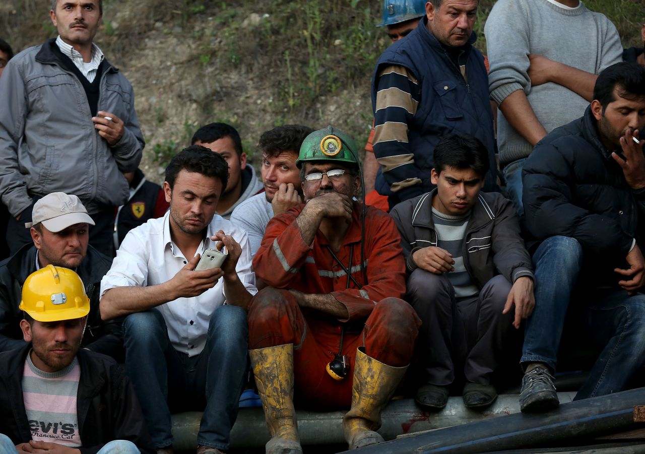Miners and relatives wait outside the mine on May 13. Turkish Energy Minister Taner Yildiz said officials turned an exit pipe "into a clean air pipe," so "there is fresh air being given in places where there is no fire."