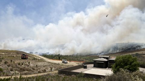 Smoke rises from a canyon where a San Diego wildfire burned on May 13.