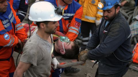 Rescue workers carry a survivor from the mine on May 14.