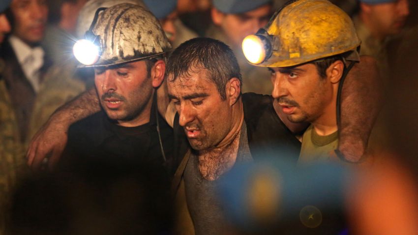 A miner is carried away from the mine by rescue workers on May 14.