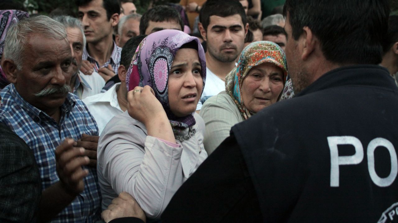 Relatives try to get information outside a Soma hospital on Tuesday, May 13.