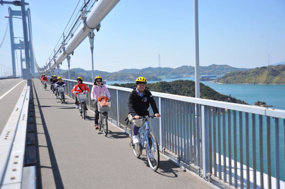 Happiness is a designated cycle lane, like this beauty stretching across Shimanami Kaido's Kurushima Bridge. 