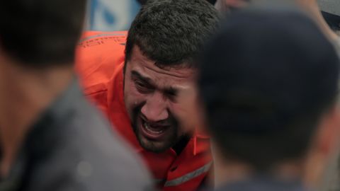 A family member cries as rescue workers carry a survivor from the mine on May 14.
