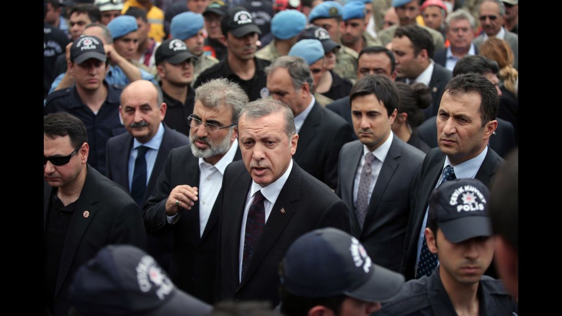 Turkish Prime Minister Recep Tayyip Erdogan, center, surrounded by security, visits the coal mine on May 14. Hundreds have taken to the streets of Istanbul and Ankara since the disaster in protest of the government and poor safety regulations. Unions have called for strikes across the country on May 15.