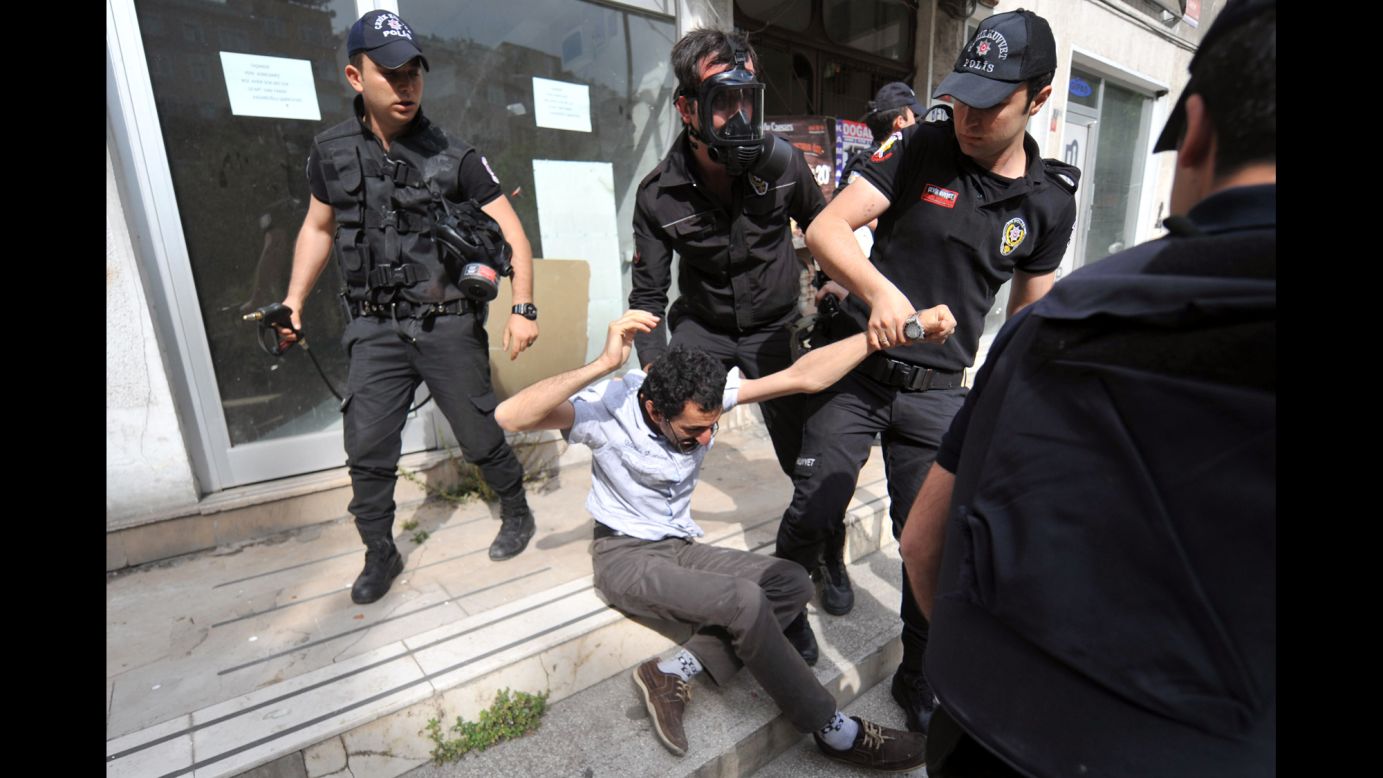 A protester is detained in front of the General Directorate of Mineral Research and Exploration headquarters in Istanbul on May 14.