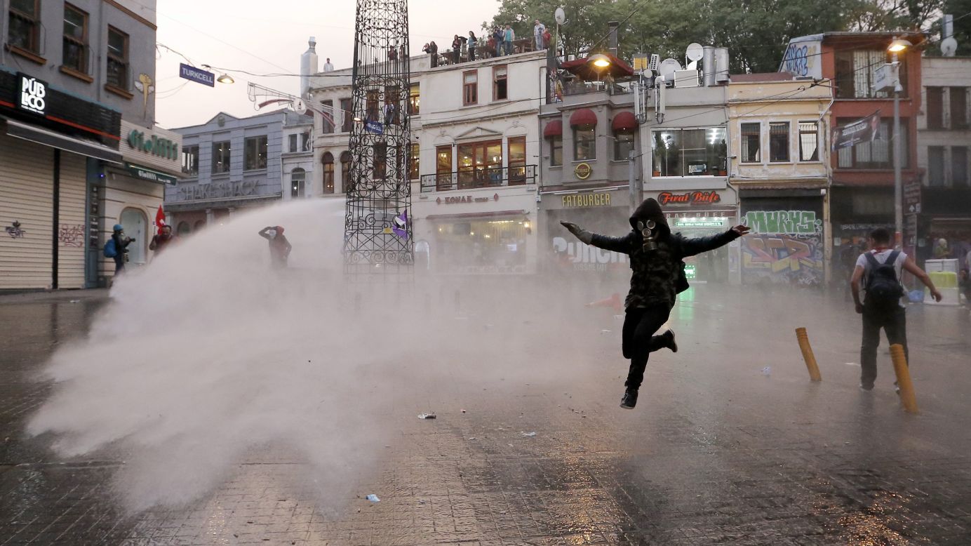Riot police use a water cannon to disperse protesters in Istanbul. 