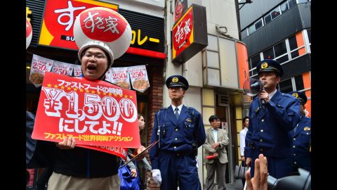 Labor union members strike in front of a McDonald's in Tokyo on May 15.