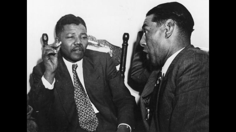 <a href="index.php?page=&url=http%3A%2F%2Fwww.cnn.com%2FSPECIALS%2Fafrica%2Fnelson-mandela%2Findex.html">South African resistance leader Nelson Mandela</a>, left, talks to Cape Town teacher C Andrews in 1964. On June 12, 1964, Mandela was sentenced to life in prison for four counts of sabotage. He was released 27 years later, and when apartheid ended he became the country's first black president.
