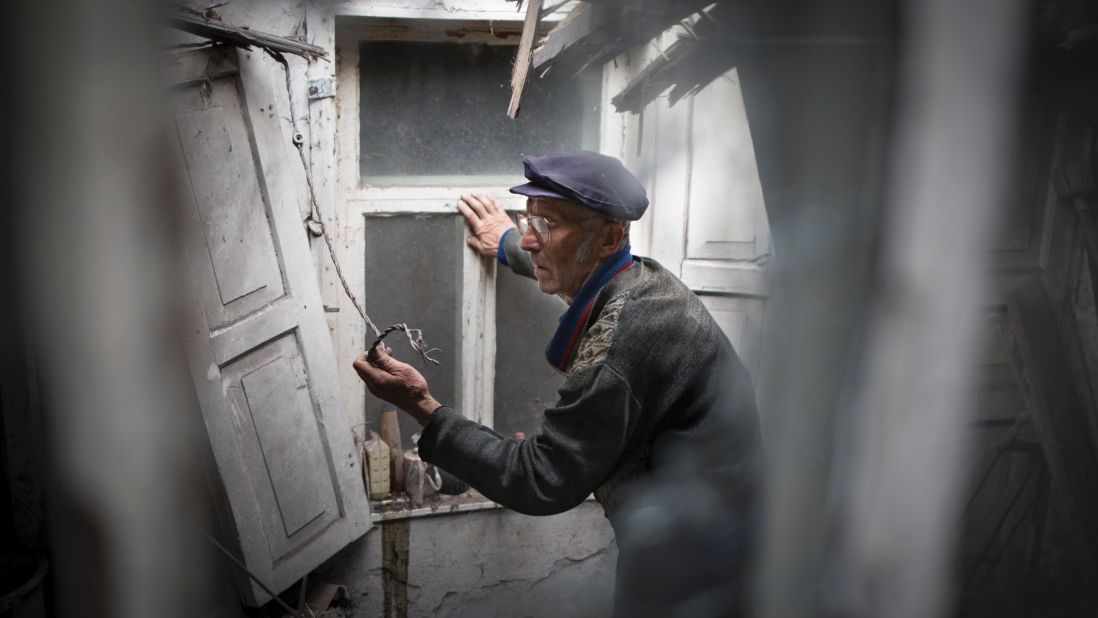 A man surveys the damage to his home after a mine exploded during an exchange of fire between pro-Russian militants and government troops outside Slovyansk on May 15.