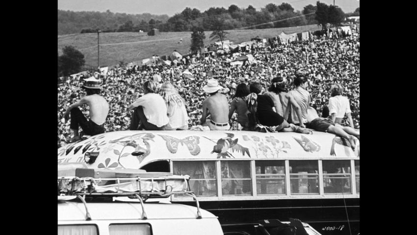 Fans sitting on top of a painted bus at the Woodstock Music Festival, Bethel, New York, 15th-17th August 1969. (Photo by Hulton Archive/Getty Images)