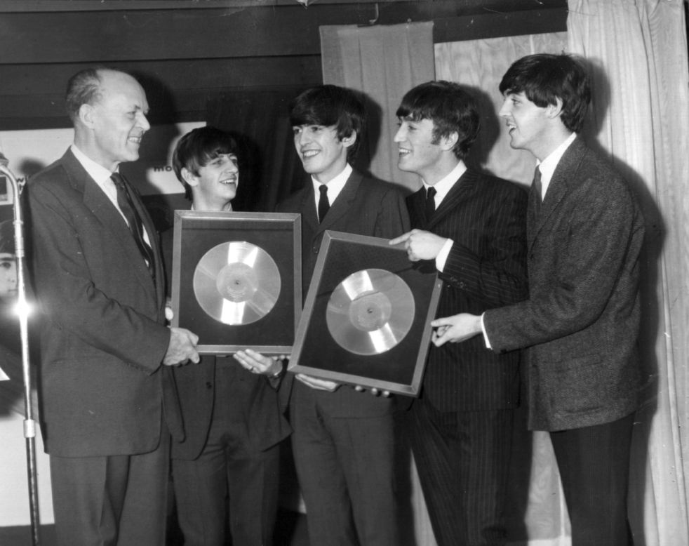 The Beatles released their first album, "Please Please Me," in the United Kingdom on March 22, 1963. Here, the band is honored on November 18, 1963, for the massive sales of albums "Please Please Me" and "With the Beatles."