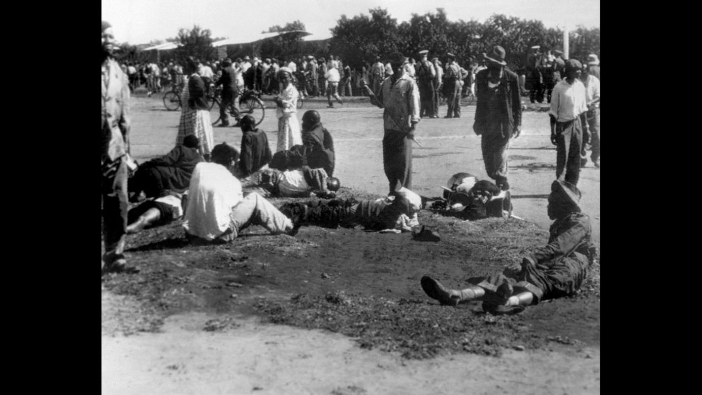 Wounded people in South Africa's Sharpeville township lie in the street on March 21, 1960, after police opened fire on black demonstrators marching against the country's segregation system known as apartheid. At least 180 black Africans, most of them women and children, were injured and 69 were killed in the Sharpeville massacre that signaled the start of armed resistance against apartheid.