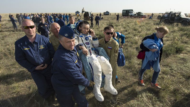 Astronaut Koichi Wakata is carried to a medical tent on Wednesday, May 14, just minutes after he and two others landed in Kazahkstan on their return to Earth. Wakata, Mikhail Tyurin and Rick Mastracchio spent more than six months aboard the International Space Station.