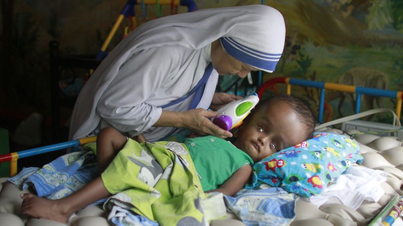 Sister Maricor from the Missionaries of Charity spends a moment with John, a 1-year-old with hydrocephalus, at an orphanage in Dhaka, Bangladesh, on Mother's Day, Sunday, May 11. Hydrocephalus is characterized by an excessive accumulation of fluid in the brain.