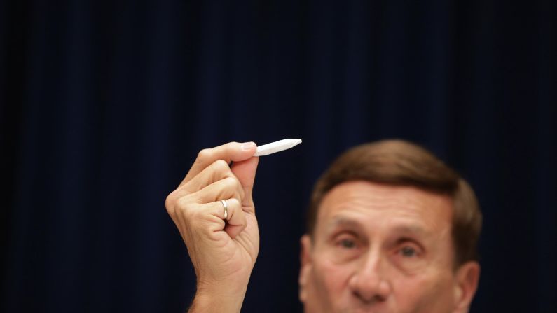 U.S. Rep. John Mica of Florida holds a fake joint Friday, May 9, during a House subcommittee hearing about marijuana laws in the nation's capital. The District of Columbia is looking to decriminalize possession of the drug. "Don't get too excited," Mica said of the prop, which he said was rolled by members of his staff.