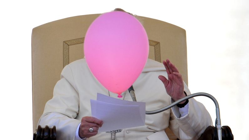 A balloon flies past Pope Francis during his general audience Wednesday, May 14, at St. Peter's Square in the Vatican.