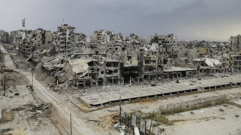 Destroyed buildings are seen in Homs, Syria, on Saturday, May 10, after an evacuation truce went into effect days earlier. Thousands of displaced residents have returned to the city, but <a href="http://www.cnn.com/2014/02/10/middleeast/gallery/syria-unrest-2014/index.html">civil war</a> still rages elsewhere in the country.