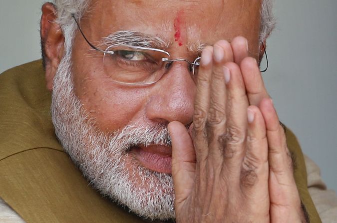 India's next prime minister, Narendra Modi, greets supporters at his mother's home in Gandhinagar on Friday, May 16. Modi is the leader of the Hindu nationalist Bharatiya Janata Party, or BJP.  After a five-week-long election, the BJP swept the ruling Indian National Congress from power. Official results were expected later Friday. 