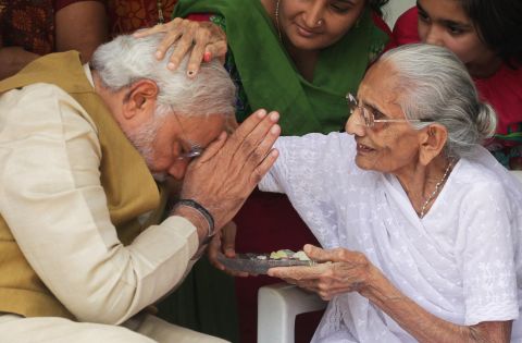 Hiraben Modi, 90, blesses her son Narendra, who becomes India's next prime minister, at her home in Gandhinagar on May 16. Analysts predict his arrival in India's top office will bring a marked change in direction for the world's most populous democracy.