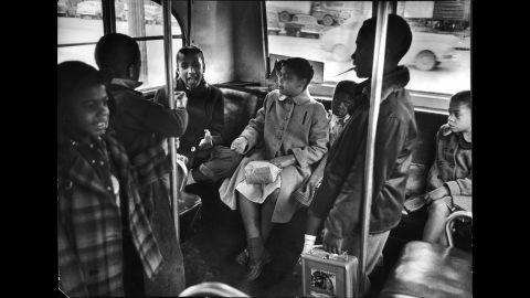 Linda Brown, center, and her sister Terry Lynn, far right, take a bus to Monroe Elementary School, an all-black school in Topeka, in 1953.