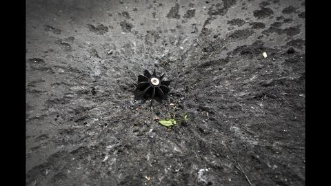A mortar shell sticks out of the ground at a checkpoint near Slovyansk on May 15.