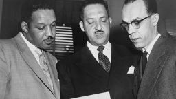 Harold P. Boulware,Thurgood Marshall, and Spottswood W. Robinson III confer at the Supreme Court prior to presenting arguments against segregation in schools during Brown v. Board of Education case.  After the initial overturning of the Kansas lawsuit, it was combined with 