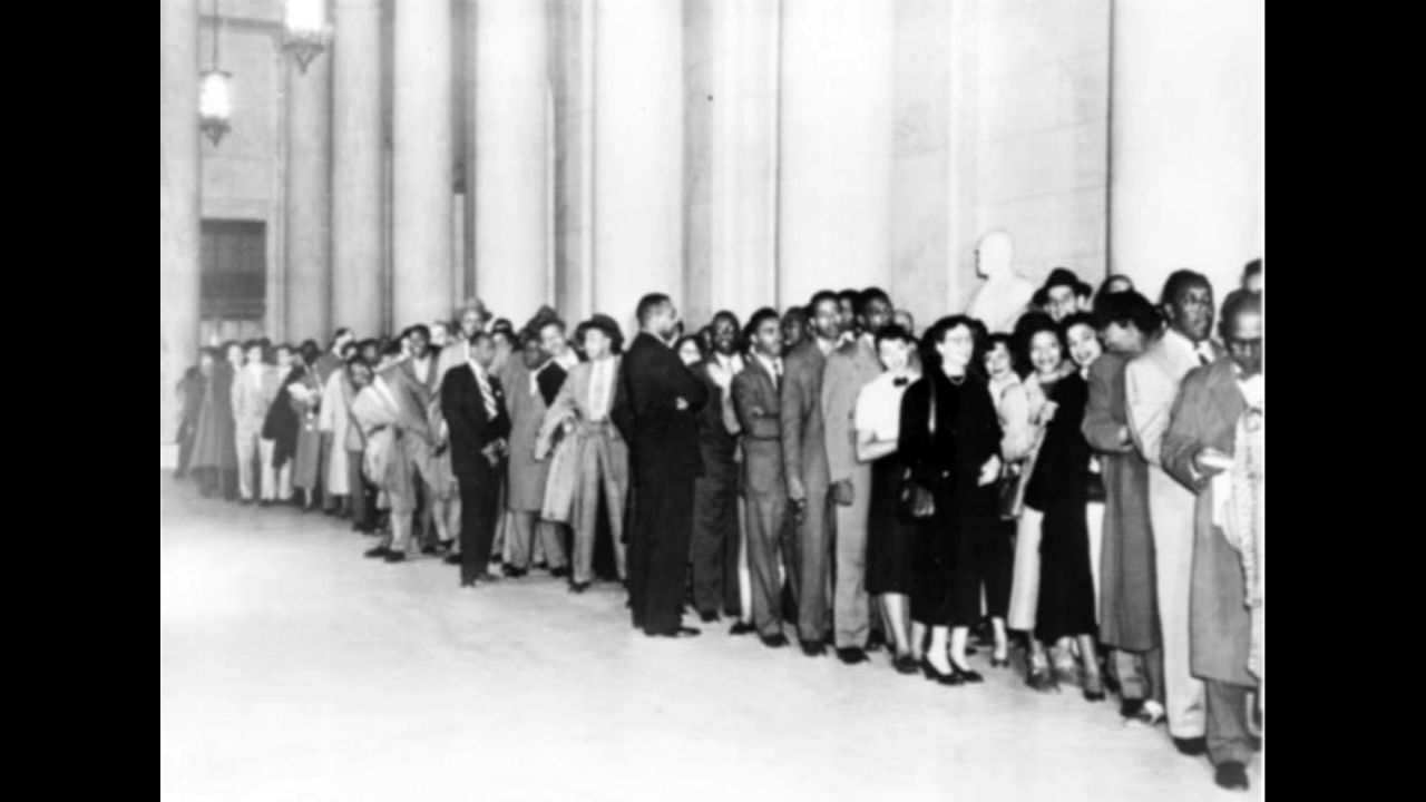 People wait in line outside the Supreme Court during the hearings in 1953.