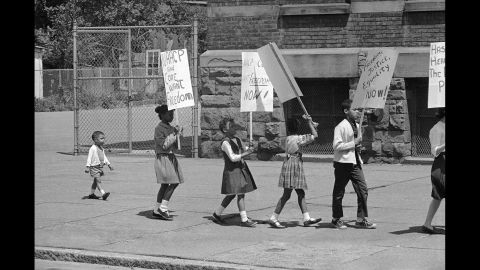 Ten years after the Supreme Court's decision, protests were still taking place. Here, 2-year-old Prentice Sharpe joins older children picketing a predominantly black elementary school in Albany, New York, on May 18, 1964.