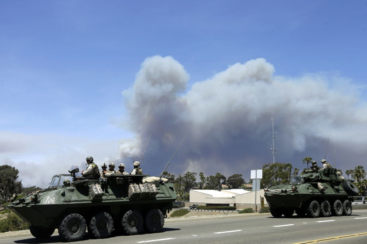 Marines move military vehicles near the entrance to Camp Pendleton on May 16.