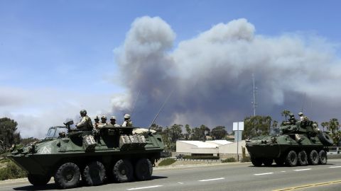 Marines move military vehicles near the entrance to Camp Pendleton on May 16.
