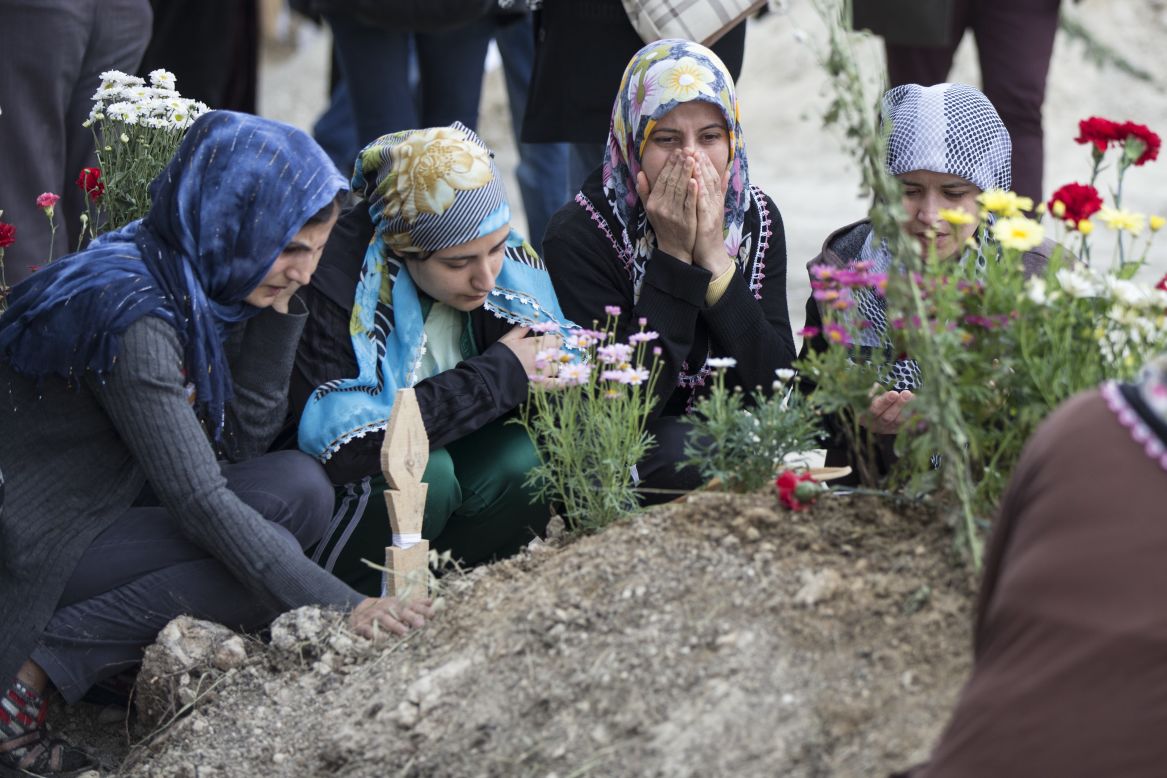 Friends and relatives of dead miners pray at a cemetery on Saturday, May 17.  The search for victims of this week's coal mine fire in Soma is now over, with a final death toll of 301, Turkish government officials said Saturday.