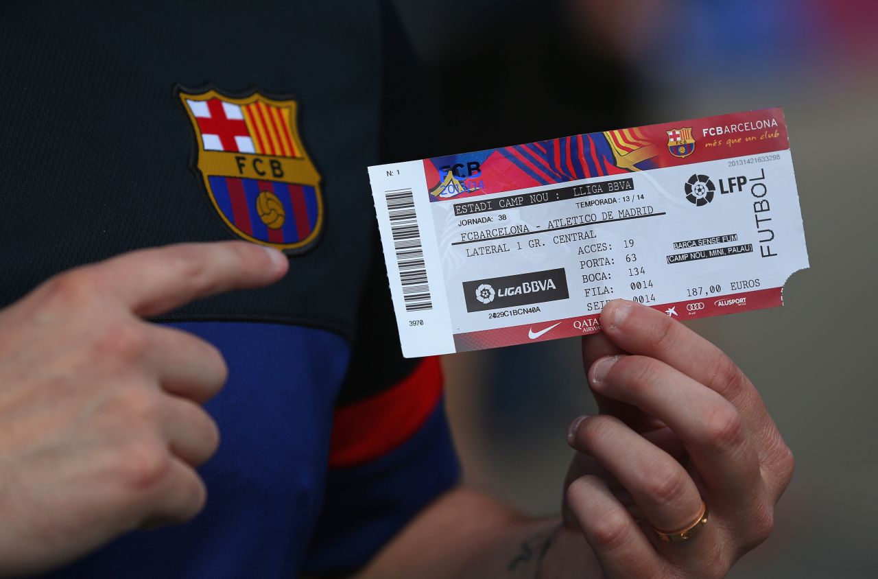 Both Barcelona and Atletico knew that victory would earn them the championship. Here a fan shows off a ticket for the title decider at Barca's Nou Camp. 