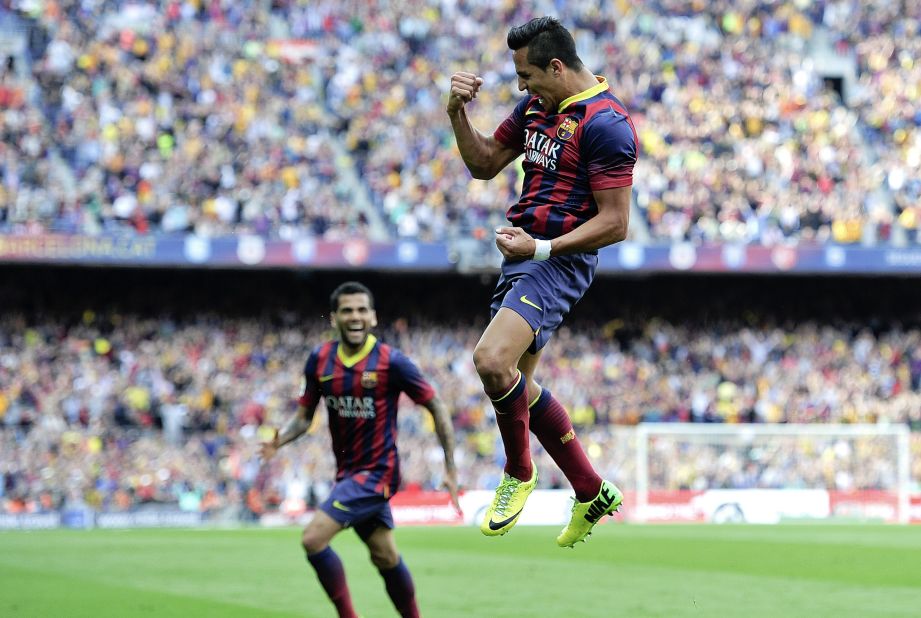 Alexis Sanchez (right) celebrates after scoring the opening goal for Barcelona, raising home hopes of a fifth title in six years.