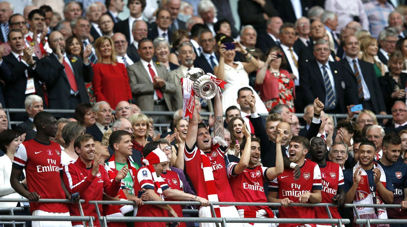 Arsenal players lift the FA Cup at Wembley Stadium following the fightback against Hull CIty on Saturday. 