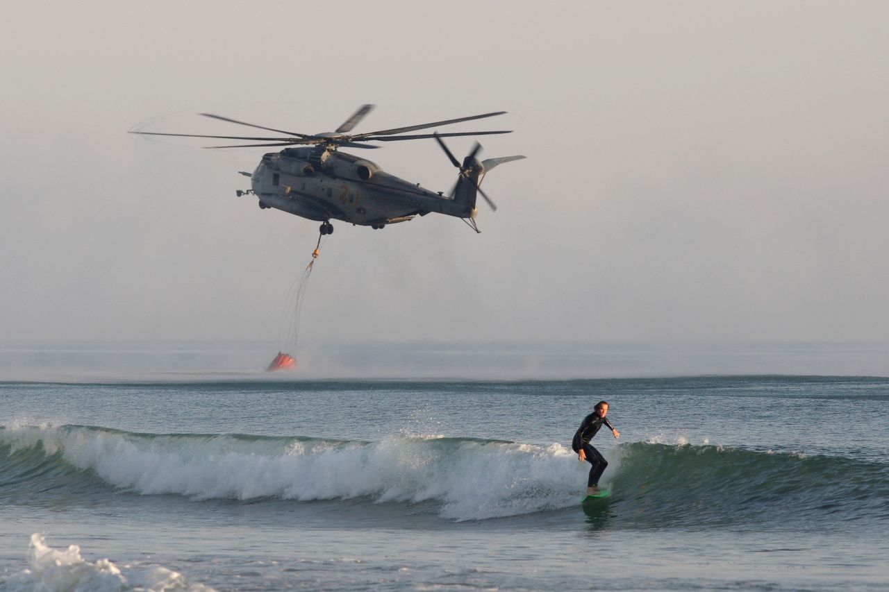 A Marine helicopter scoops water from the ocean to fight a wildfire near Camp Pendleton on May 16.