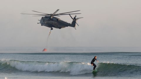 A Marine helicopter scoops water from the ocean to fight a wildfire near Camp Pendleton on May 16.