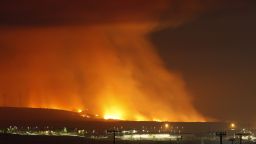 Flames from the Las Pulgas Fire lighus up the sky on May 16 at Camp Pendleton, California.