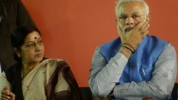 :Indian Bharatiya Janata Party (BJP) leader and prime-minister elect Narendra Modi (R) and senior BJP leader and leader of the opposition Sushma Swaraj attend a meeting at the party headquarters in New Delhi on May 17, 2014.