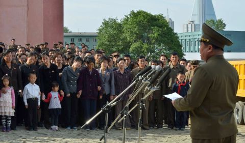 A North Korean official apologizes on Saturday, May 17, in front of residents and families of victims of an accident at an apartment construction site in Pyongyang, North Korea. 