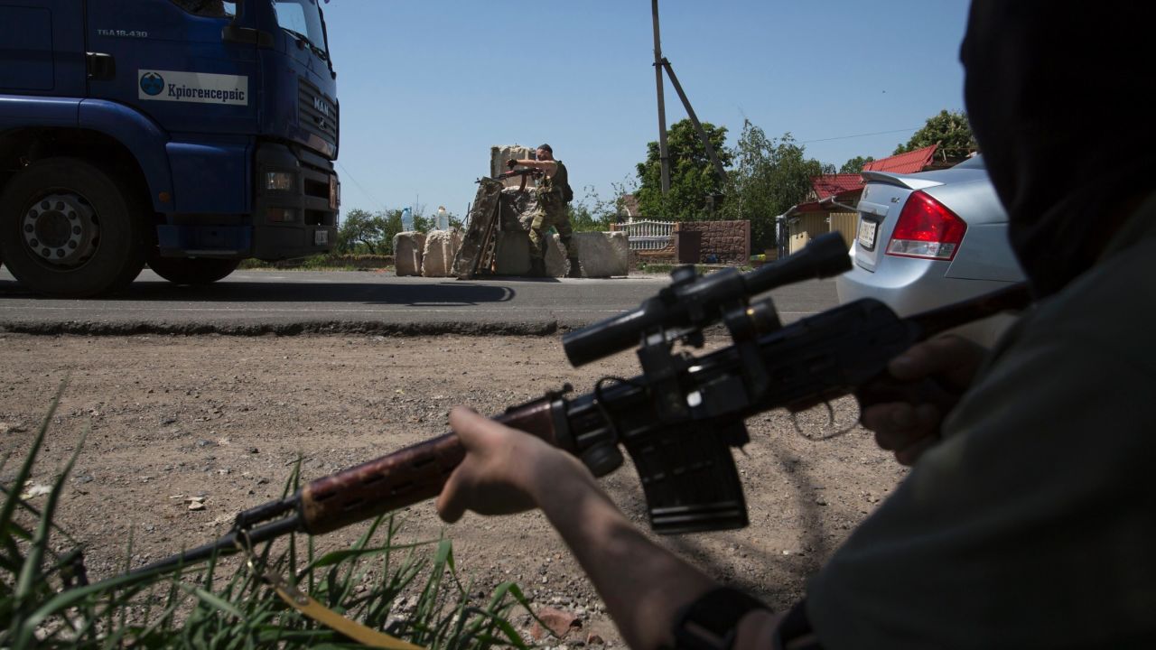 Pro-Russian militants guard a checkpoint outside Slovyansk on Saturday, May 17.