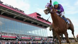 BALTIMORE, MD - MAY 17:  California Chrome #3, ridden by Victor Espinoza, races to the finish line enroute to winning the 139th running of the Preakness Stakes at Pimlico Race Course on May 17, 2014 in Baltimore, Maryland.  (Photo by Rob Carr/Getty Images)