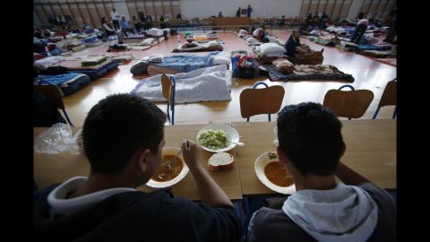People take shelter at a sports center in Odzak, Bosnia-Herzegovina, on May 19.