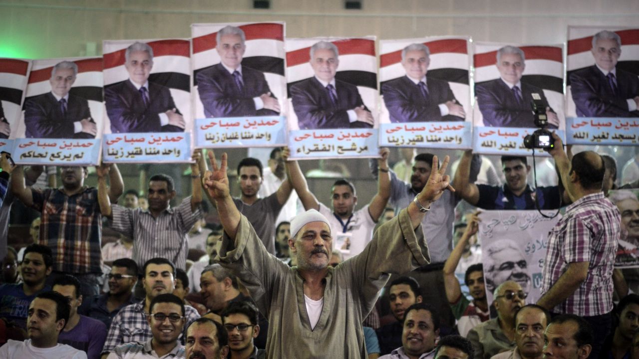 Supporters of Egyptian leftist presidential candidate Hamdeen Sabahi (portrait) attend a campaign meeting in Cairo.