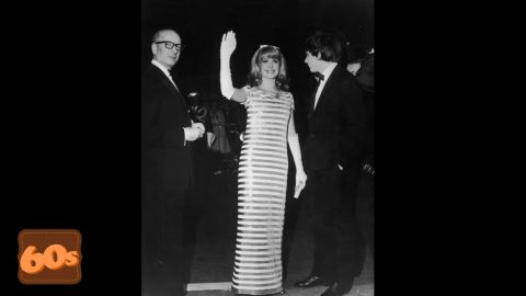French actress Catherine Deneuve greets her fans in white gloves and sequins at the 1966 Cannes Film Festival. She appeared in her 100th film "Un conte de Noël" in 2008 aged 64. 
