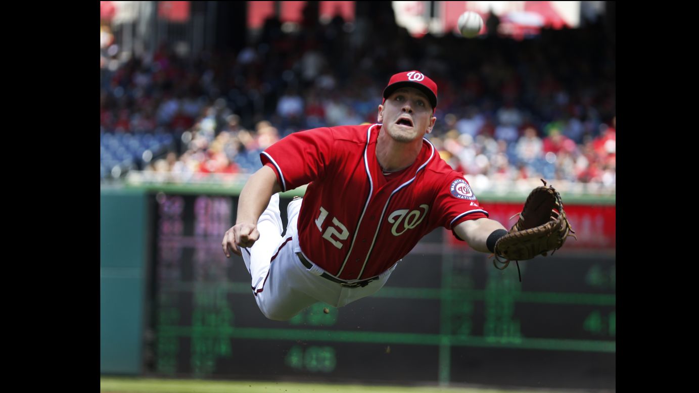Washington Nationals first baseman Tyler Moore makes a diving catch during a home game against the New York Mets on Sunday, May 18. The Nationals won the game 6-3 to take two of three in the weekend series.