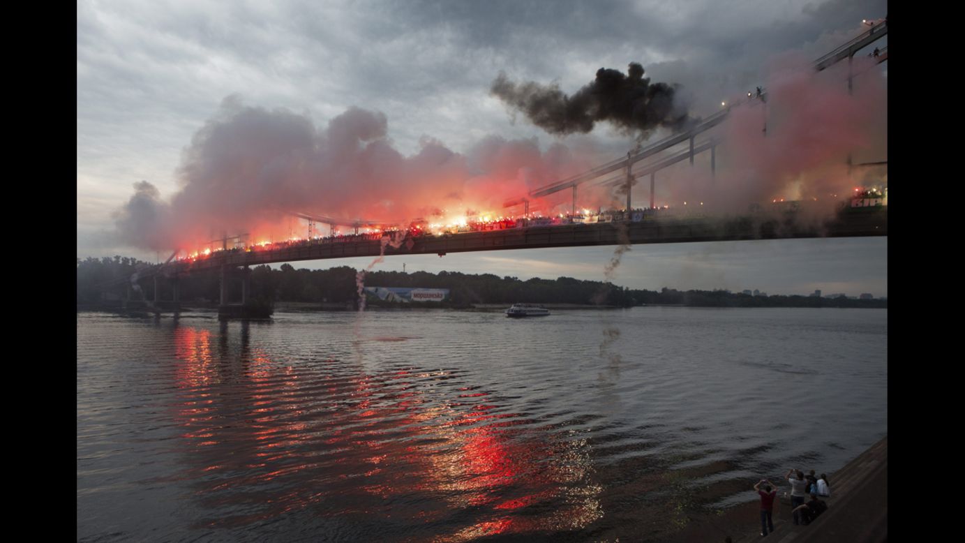 To show support for a united Ukraine, about 2,000 fans from six Ukrainian soccer clubs gathered Sunday, May 18, and burned flares on a bridge in the country's capital of Kiev.