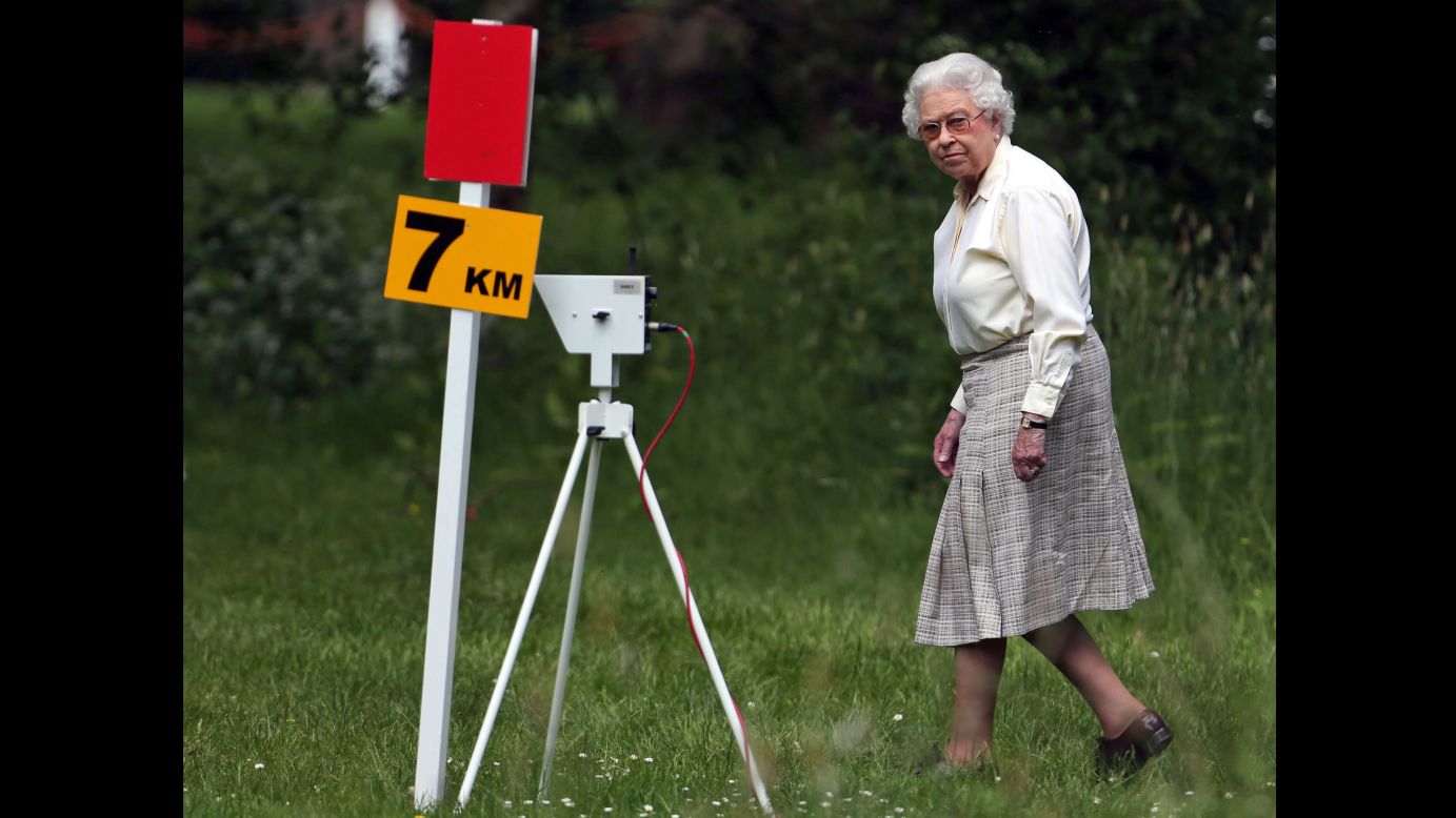 Britain's Queen Elizabeth II watches competitors in the Land Rover International Driving Grand Prix, an equestrian event held Saturday, May 17, at Windsor Castle in Windsor, England. The Royal Windsor Horse Show has been held annually since 1943.