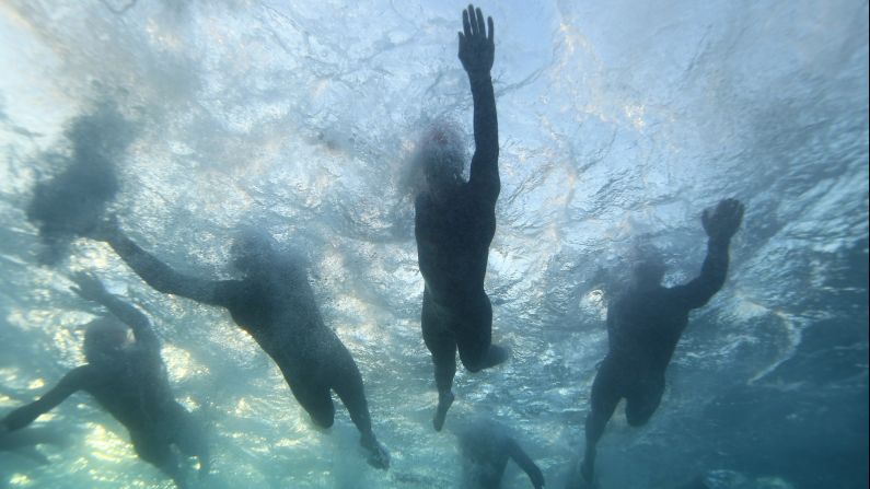 Athletes swim during the Ironman triathlon held Saturday, May 17, in Lanzarote, Spain. The swimming portion of an Ironman triathlon is 2.4 miles, and it precedes a 112-mile bike ride and a 26.2-mile run. Romain Guillaume of France won the men's race in Lanzarote with a time of 8 hours, 47 minutes and 39 seconds, while Lucy Gossage of Great Britain won the women's race with a time of 9 hours, 41 minutes and 40 seconds.