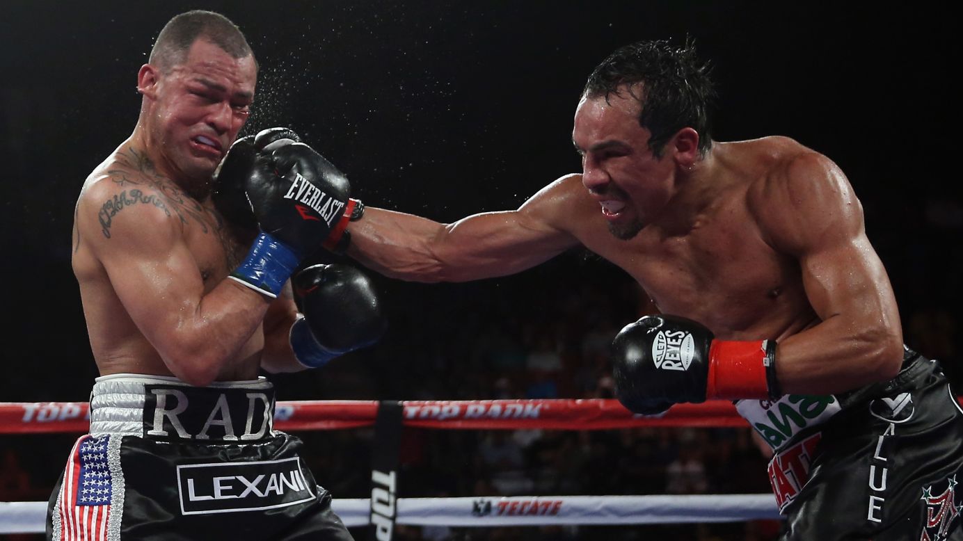 Juan Manuel Marquez lands a right hand to Mike Alvarado's chin in their welterweight bout Saturday, May 17, in Inglewood, California. Marquez won by unanimous decision.