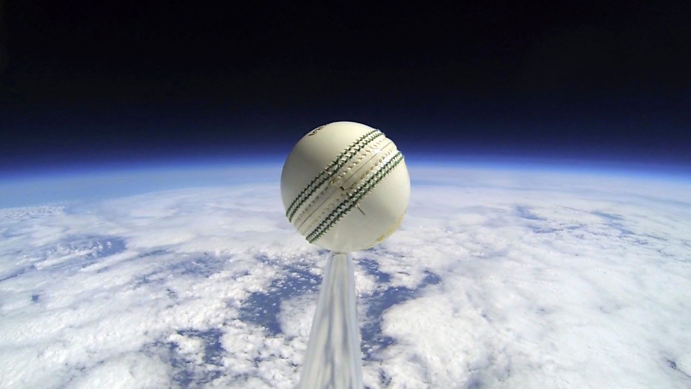 A cricket ball is seen on the edge of outer space after it was attached to a helium balloon and launched to an altitude of 110,000 feet -- approximately three times the cruising altitude of a commercial airplane. The England and Wales Cricket Board worked with a team of engineers for the launch, which announced the start of the NatWest T20 Blast competition on Friday, May 16. The ball landed safely back to Earth in near-perfect condition.